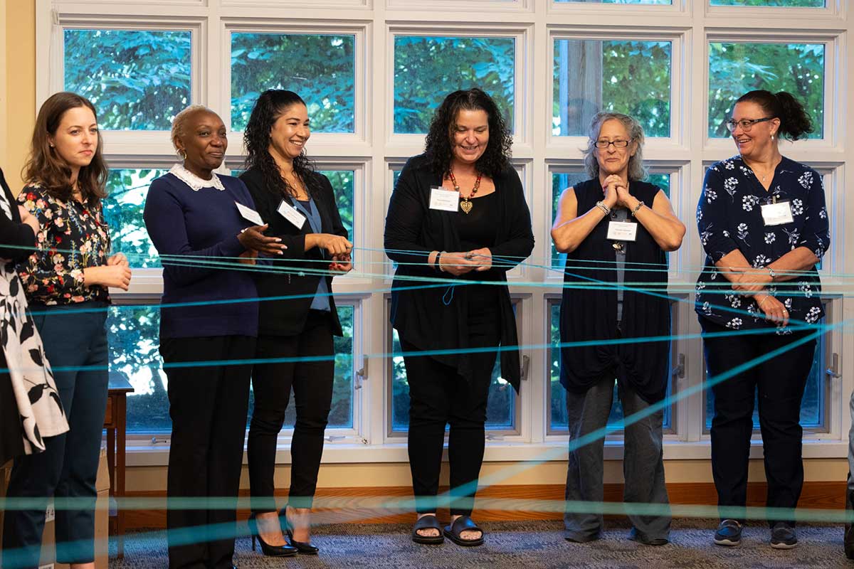 Six women with nametags standing