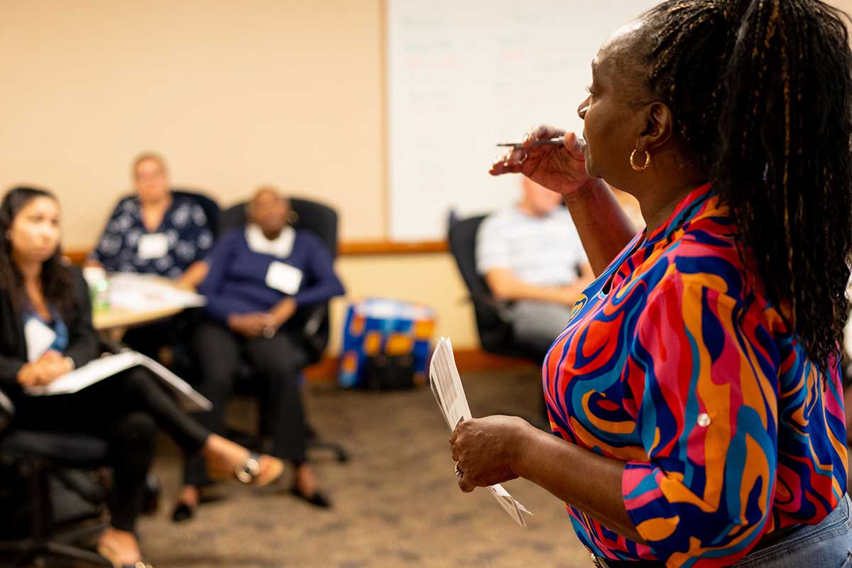 Woman speaking to people