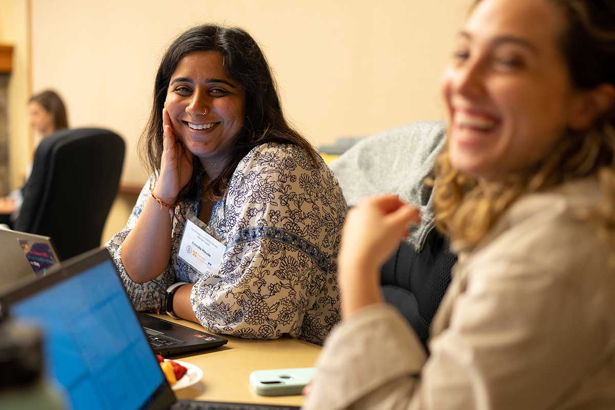 People smiling and laughing in office